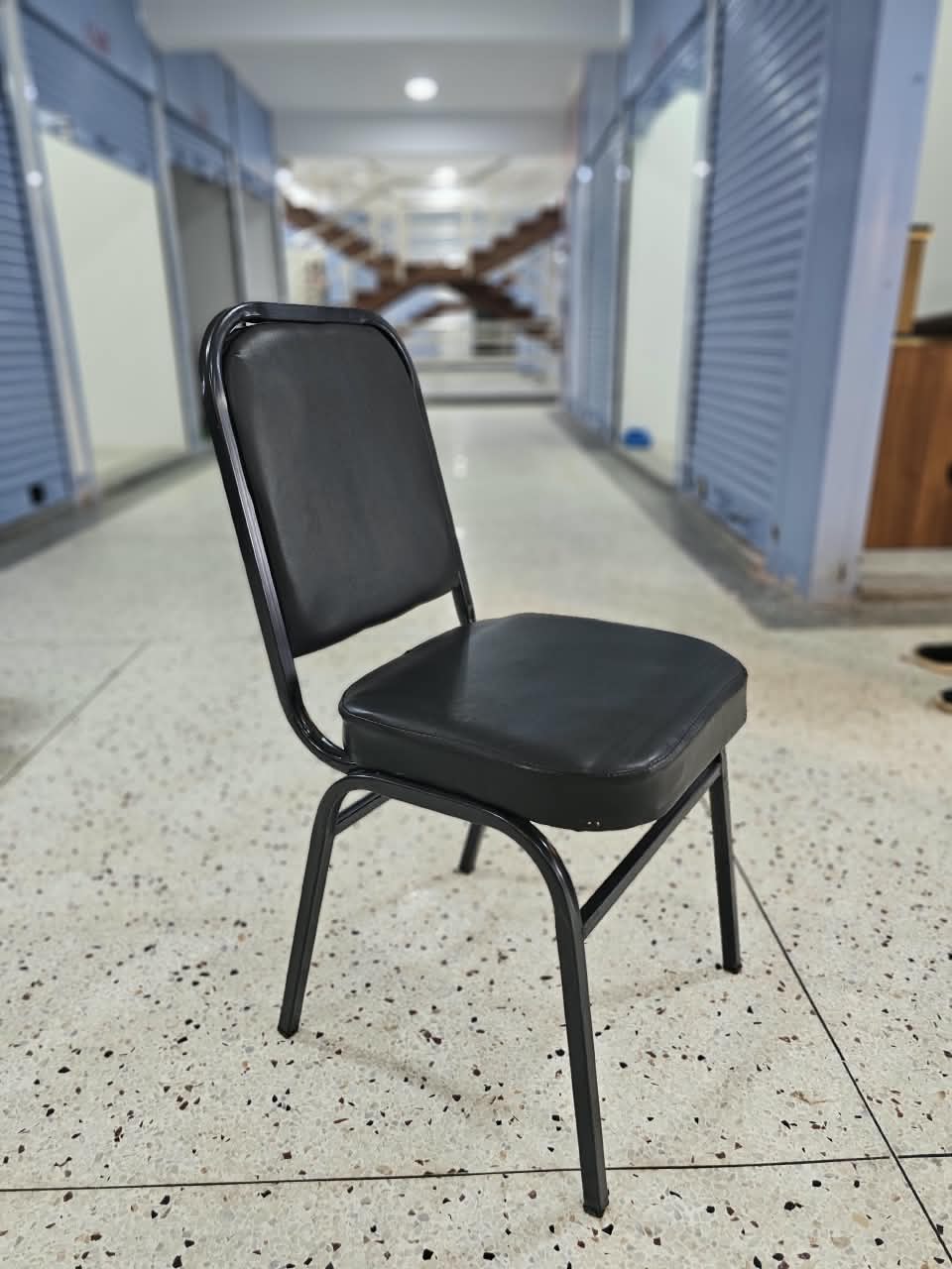 Black Stackable Banquet Chair – Padded Vinyl Seat, Sturdy Metal Frame & Upholstered Design